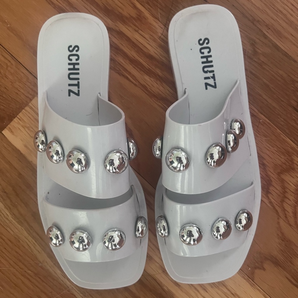 Schutz White Slide Sandals with Silver Accents